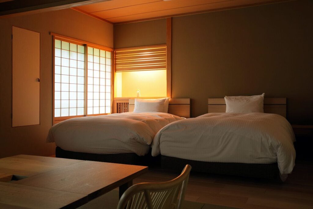 Twin Bed Room With Dark Interior And Low Table