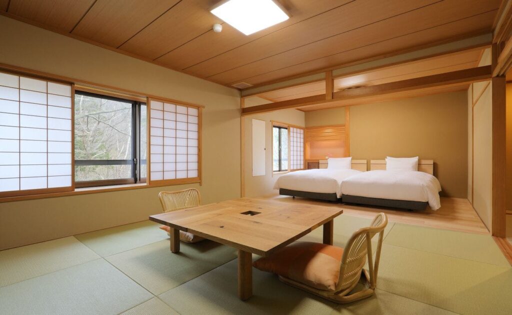 Twin Bed Room With Low Table And Chair