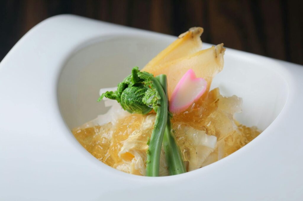 Vegetable And Tofu Dish In A White Bowl